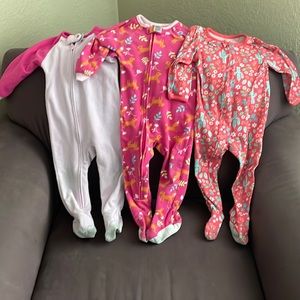 Three pair of footed pajamas
